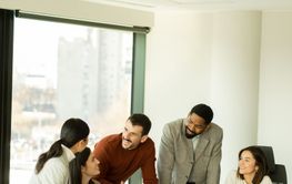 Collaboration thrives in a modern office with stylish...