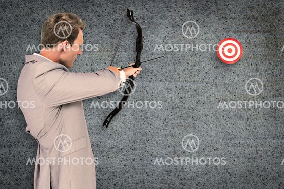 Composite image of businessman shooting target