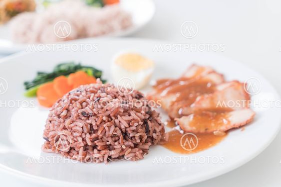 Barbecued red pork in sauce with berry rice