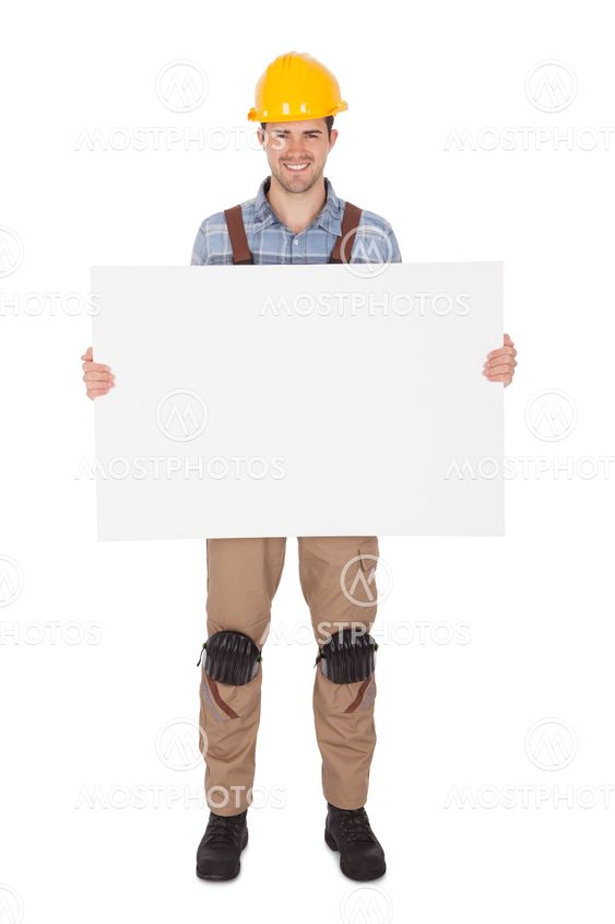 Worker wearing hard hat and holding empty banner