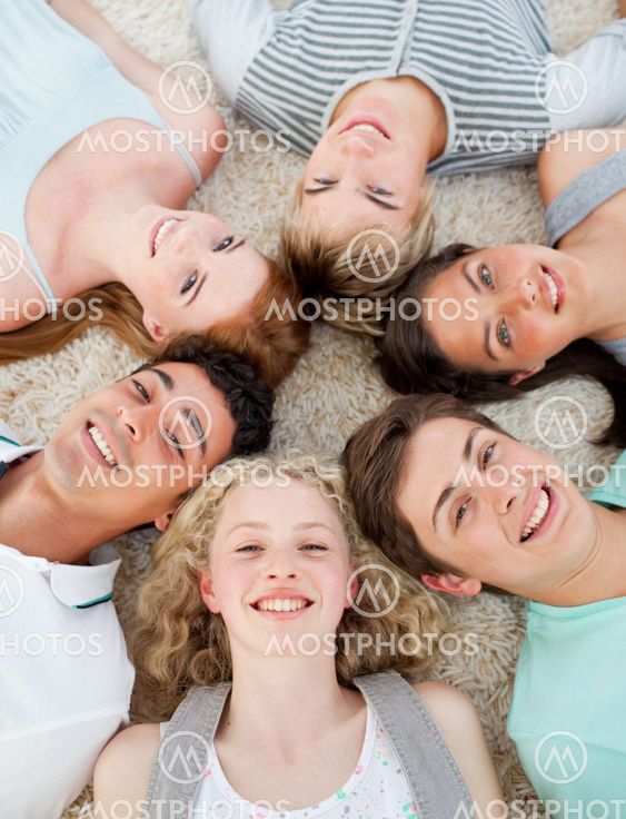 Friends with their heads together smiling