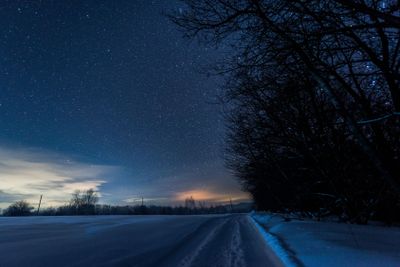 starry dark sky and road in carpathian mountains at night...