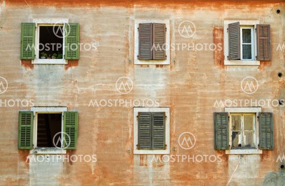 Facade with window-shutters.