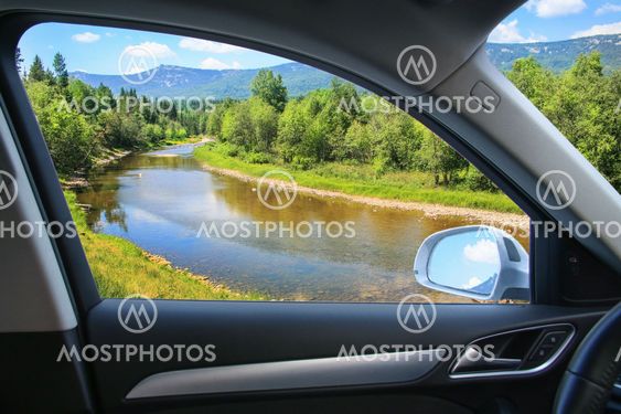 landscape with river from car window