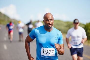 Sweating, man and running marathon in road for endurance...