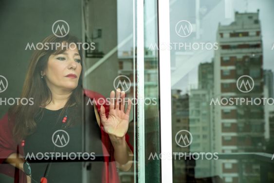 Mature woman looking out the window