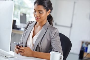 Woman, typing and professional with phone in office,...