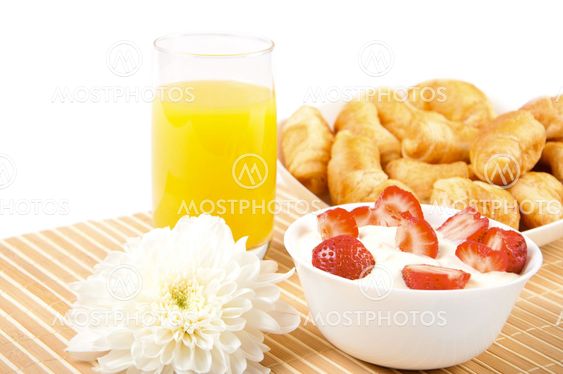Breakfast with berries,orange juice and croissant
