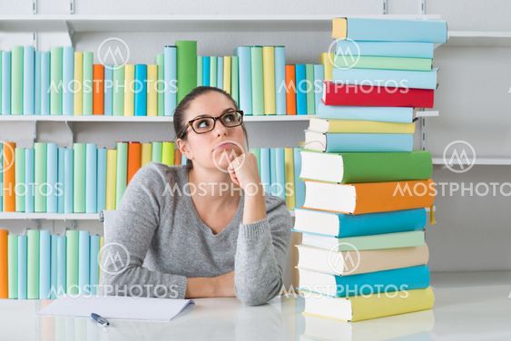 Contemplating Woman Sitting At Desk