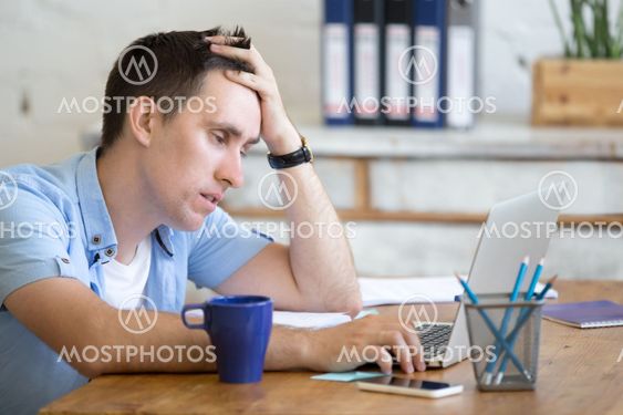 Bored young worker man