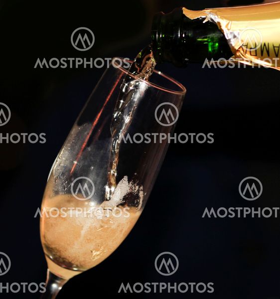 Close up of pouring champagne