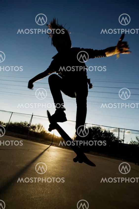 Teenage Skateboarder at Sunset