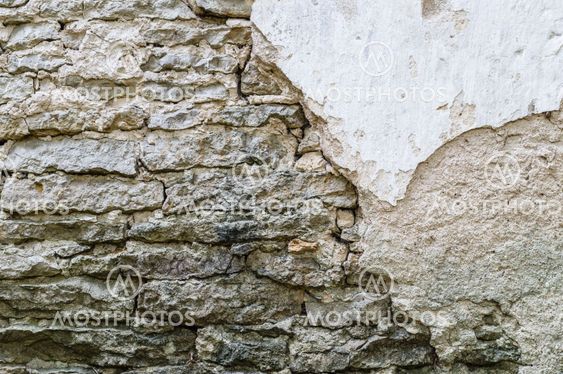 Old damaged stone and concrete wall