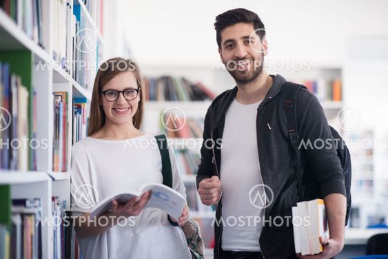 students couple in school library