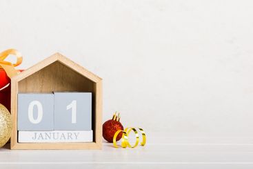 1 january. Christmas composition on colored background...