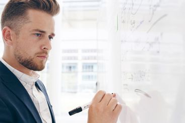 Business, writing and man with whiteboard, planning for...