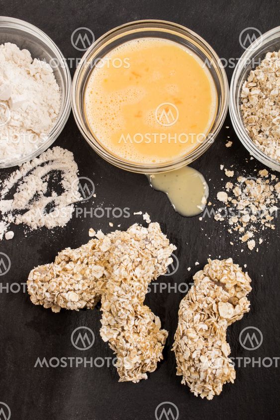 with oatmeal breaded chicken breast strips on slate