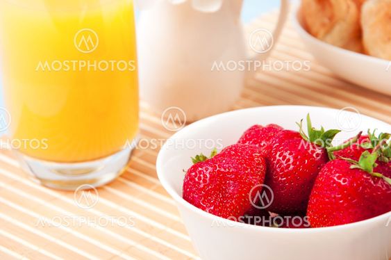 Breakfast with berries,orange juice and croissant