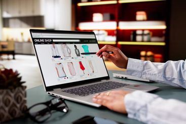 Woman Online Shopping On Laptop