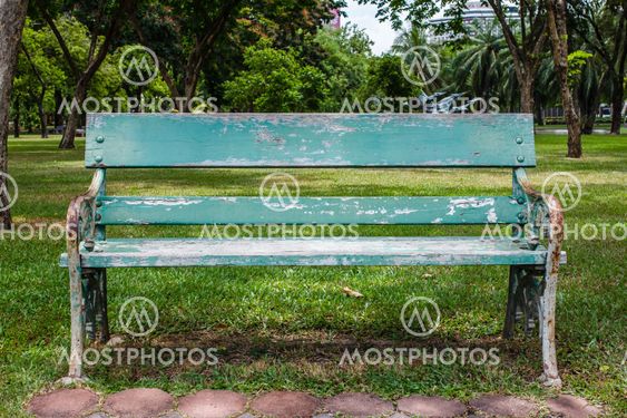 wooden park bench at a park