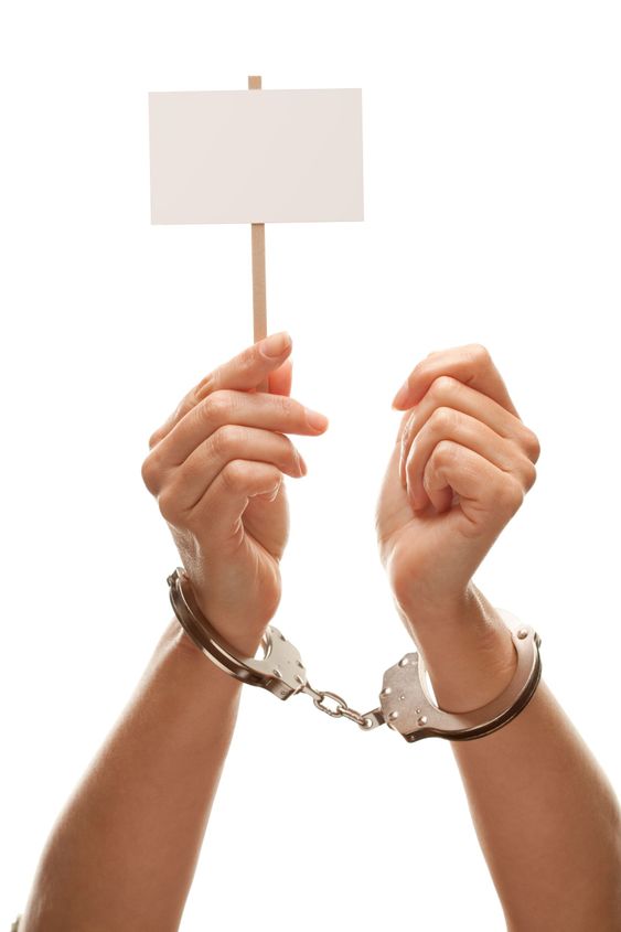 Handcuffed Woman Holding Blank White Sign Isolated on White