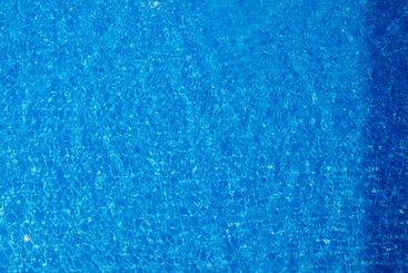 Clear blue water reflecting sunlight in a tropical...