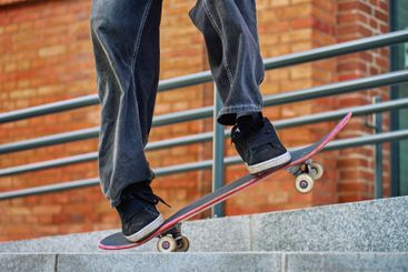 Skateboarder Performing Trick on Urban Street