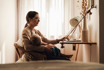 Woman working at home with her baby