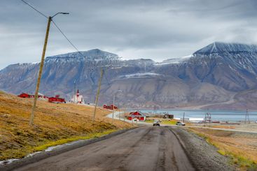 Road to mountains and village in Svalbard, Norway