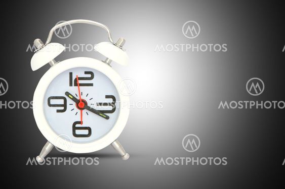alarm clock isolated over black