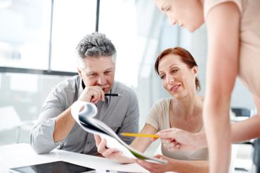 Business people, meeting and discussion with documents...