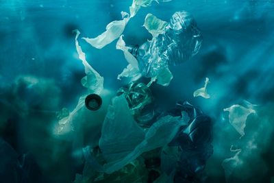 Toxic plastic waste floating underwater in the ocean