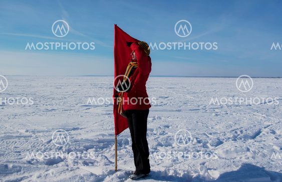 Happy girl with a red flag