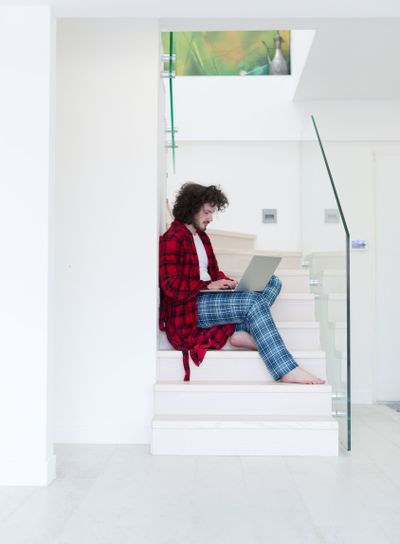 freelancer in bathrobe working from home