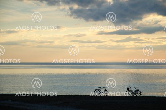Silhouettes of two bikes