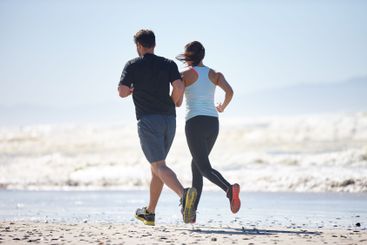 Ocean, back and couple with fitness, running and...