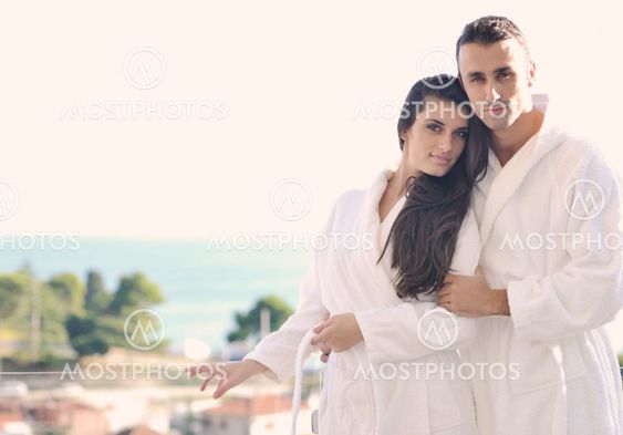 couple relaxing on balcony