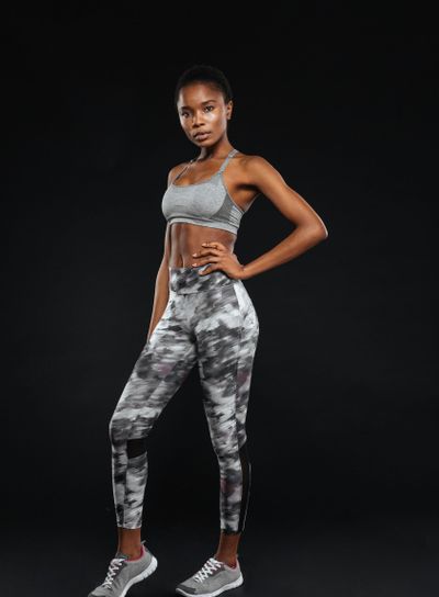 Full length portrait of a sporty afro american woman