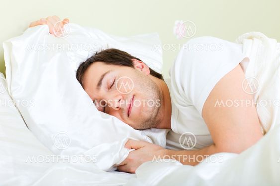 Man sleeping in bed