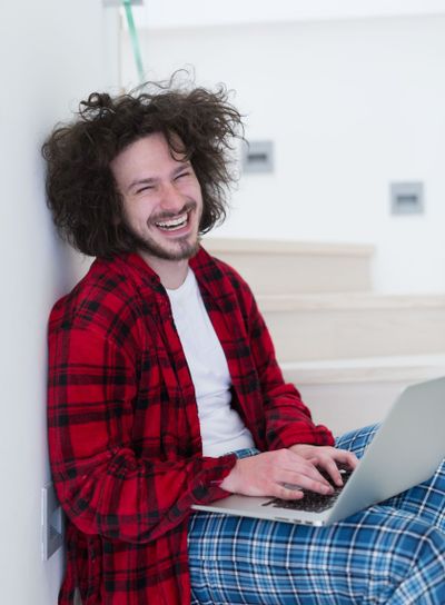 freelancer in bathrobe working from home