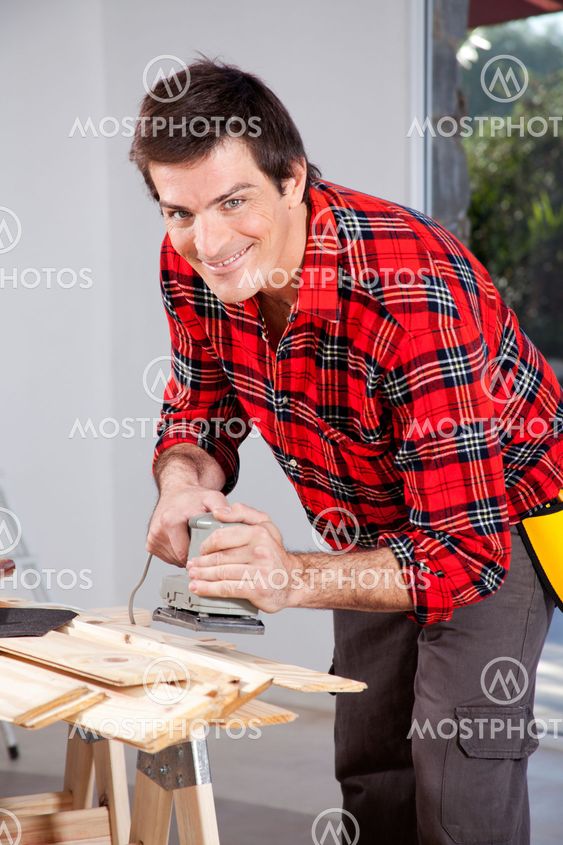 Man with Electric Hand Sander