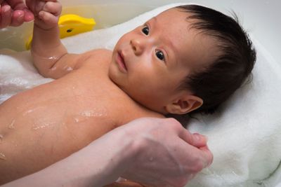 Little baby taking a bath