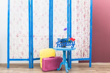 Blue wooden decorating screen with textile panels