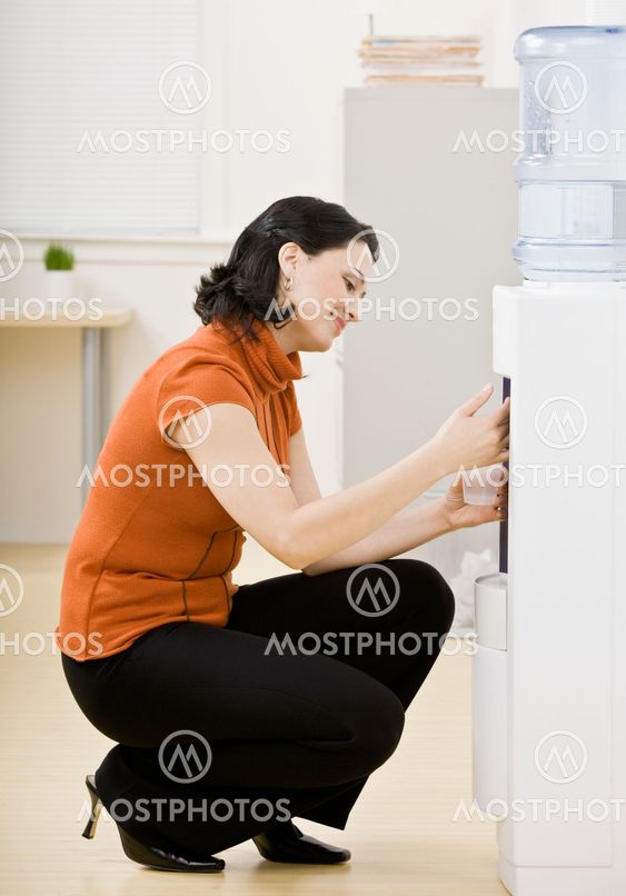 Businesswoman at Water Cooler