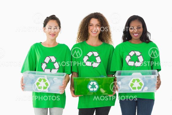 Team of environmental activists holding boxes smiling at camera