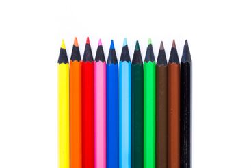 Bright colored pencils arranged neatly in a row for...