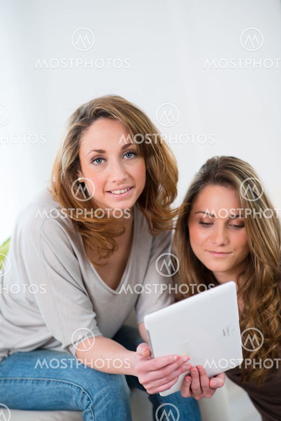 portrait of two beautiful girls at home