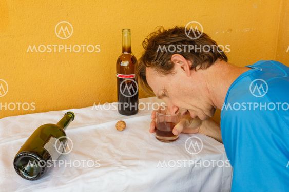 a drunk man shumped on the table