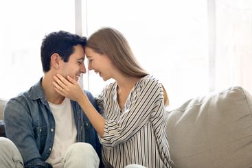 Cheerful cute young Hispanic couple enjoying romantic...
