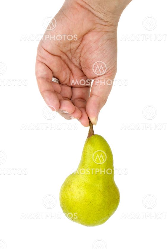 Hand holding green pear